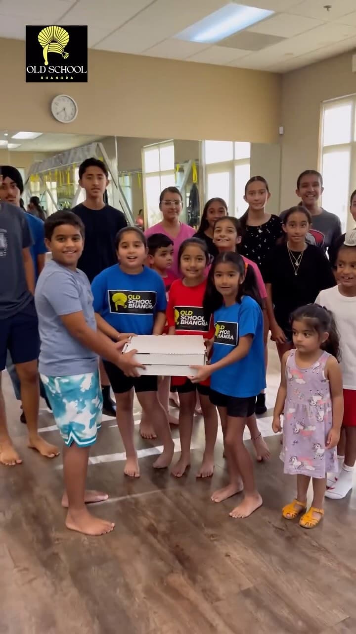 Curry Pizza distributing pizzas at Old School Bhangra event